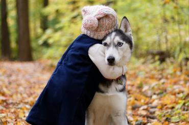 girl hugging dog